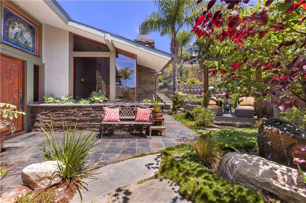 You are greeted to a beautiful front yard as you approach the front door. - 945 Meadowlark Lane, Laguna Beach CA 92651 - photo 1