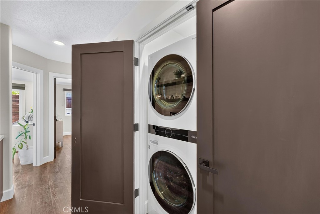 Double door closet Laundry Space - 16 Deer Creek Lane, Laguna Hills CA 92653 - photo 20