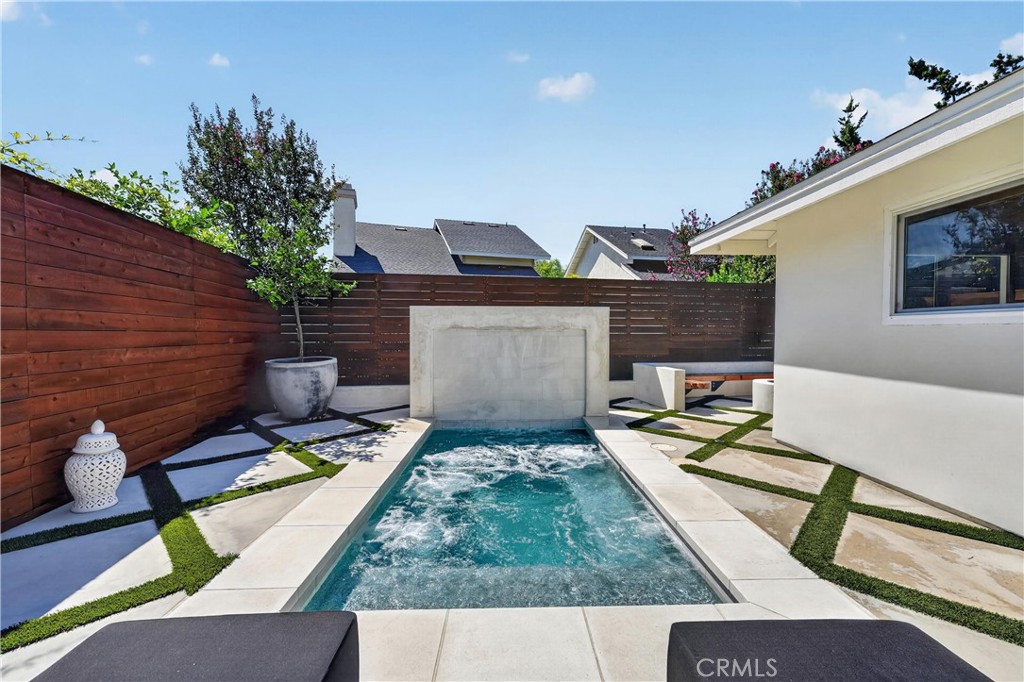 Salt water waterfall pool/spa with ambiance changing lights. - 16 Deer Creek Lane, Laguna Hills CA 92653 - photo 37