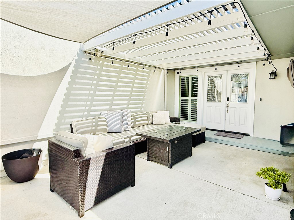 Courtyard with double entry front doors, patio cover and sunshade - 22256 Caminito Danubo, Laguna Hills CA 92653 - photo 1