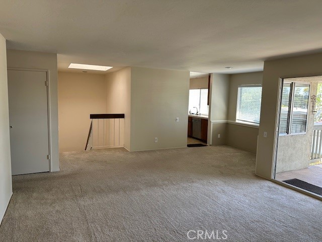 Large family room, designated dining area and spacious fully covered patio. - 23325 Caminito Juanico, Laguna Hills CA 92653 - photo 2