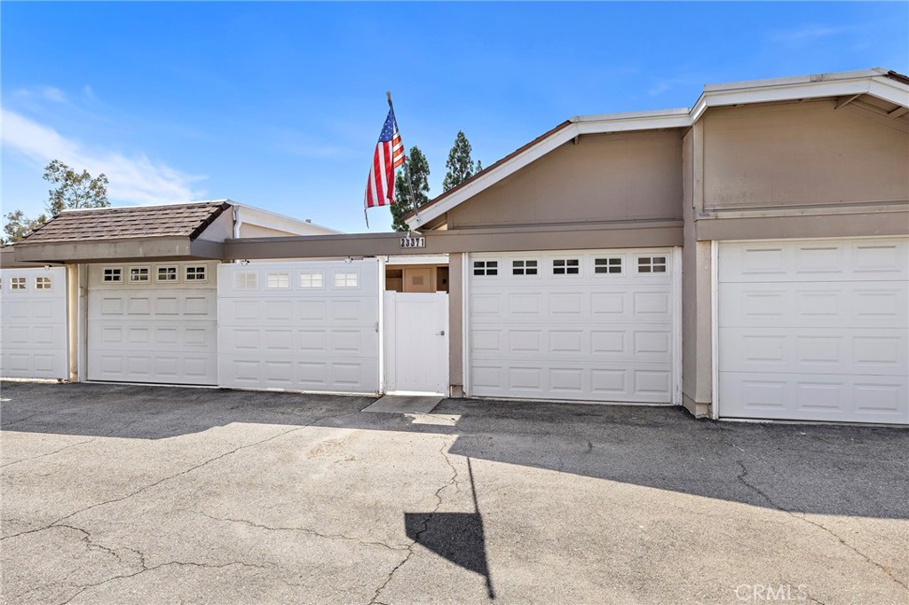 Welcome to your new home -- 1 car garage door to the right of the entry gate - 23371 Caminito Telmo 180, Laguna Hills CA 92653 - photo 1