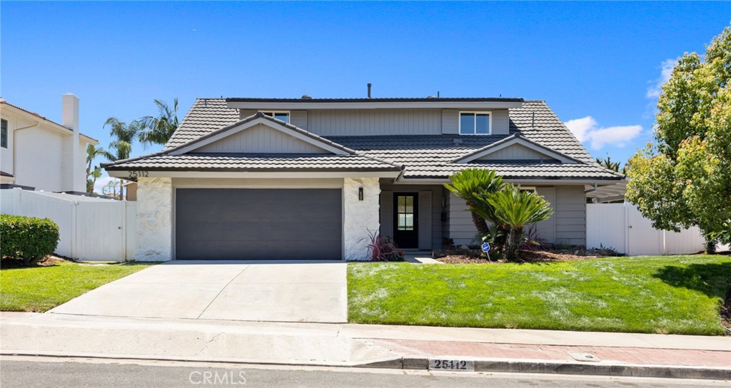 Brand new facade, new exterior paint, fixtures, garage door and front door!Great curb appeal on a beautiful street. - 25112 Vespucci Road, Laguna Hills CA 92653 - photo 1