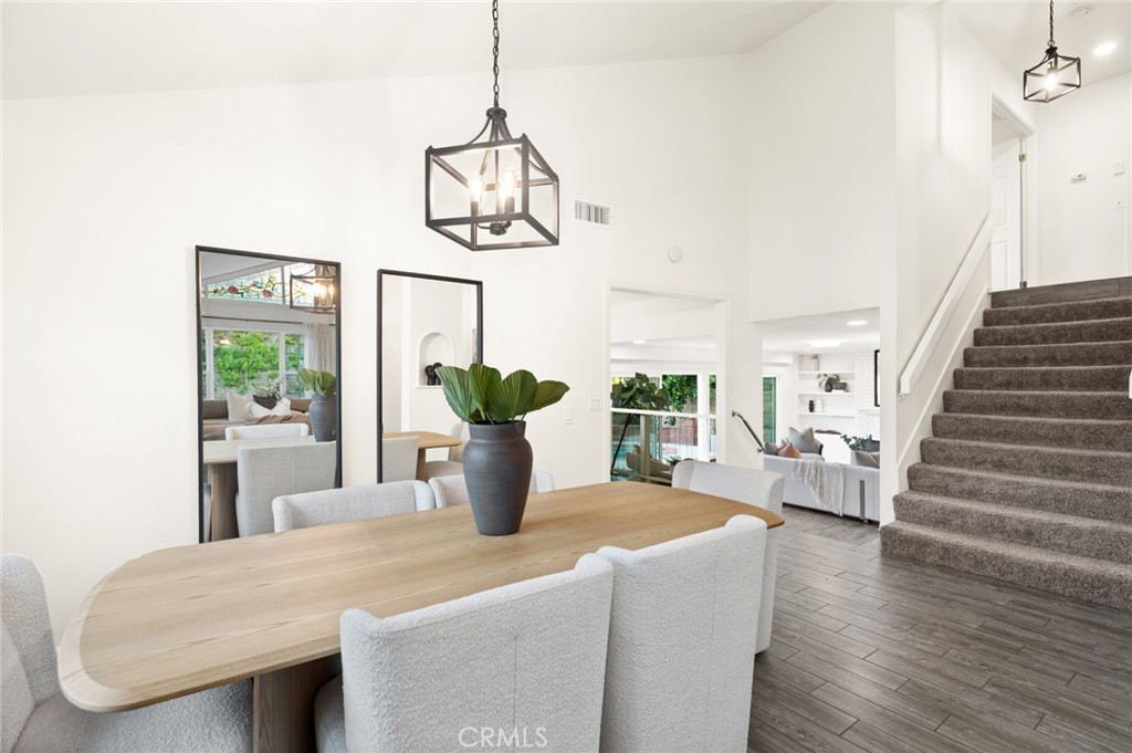 From the charming front courtyard, step inside to soaring vaulted ceilings, abundant natural light, VIEWS, & an open, we - 25182 Stockport, Laguna Hills CA 92653 - photo 5