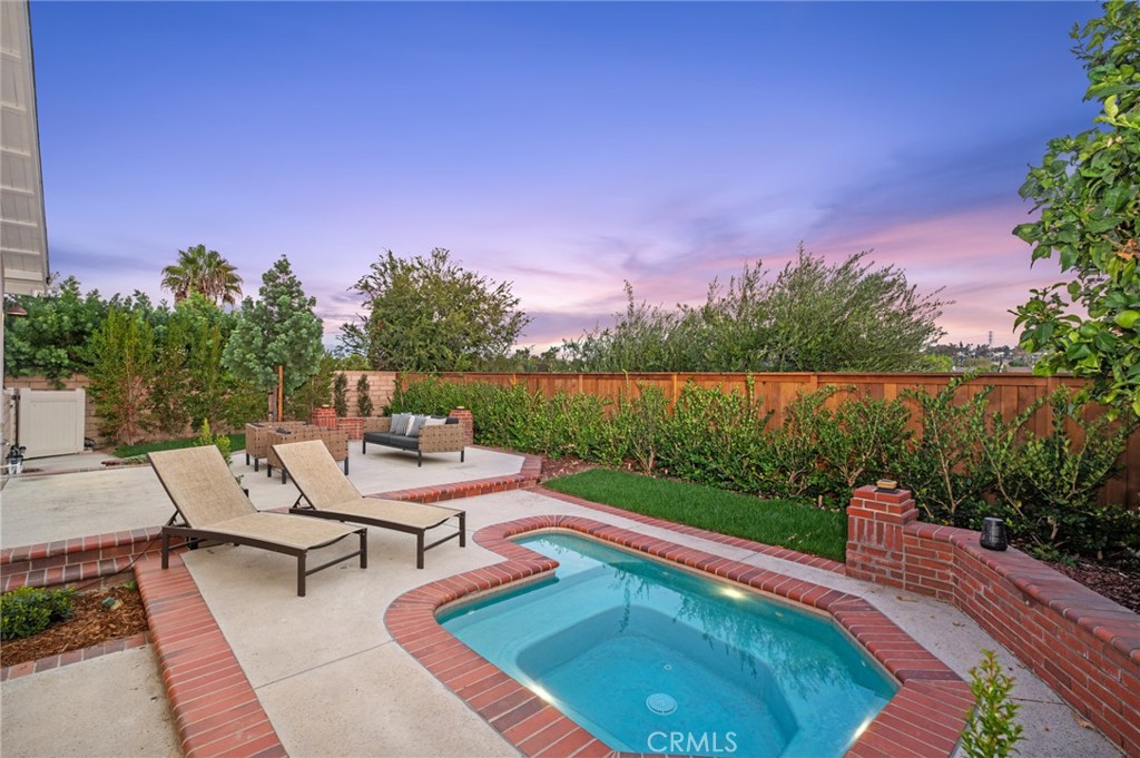 The sparkling in ground jacuzzi spa creates a resort-inspired setting - 25182 Stockport, Laguna Hills CA 92653 - photo 10