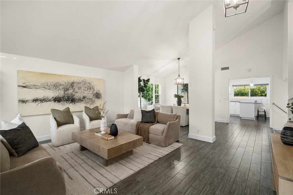 The living & dining areas flow naturally into the beautifully appointed kitchen - 25182 Stockport, Laguna Hills CA 92653 - photo 12