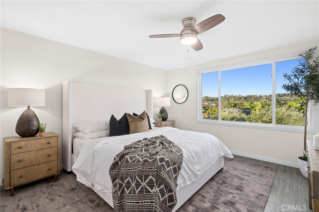 Upstairs, the spacious primary suite w/beautiful views - 25182 Stockport, Laguna Hills CA 92653 - photo 29