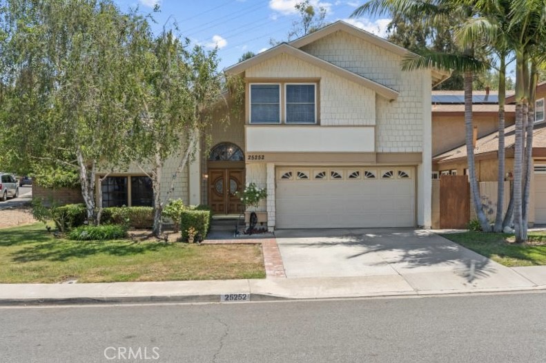 LOCATION LOCATION LOCATION! Steps away from El Conejo Park in established hidden gem Aliso Place with 4BR 3BA, main floo - 25252 Calero Avenue, Laguna Hills CA 92653 - photo 1