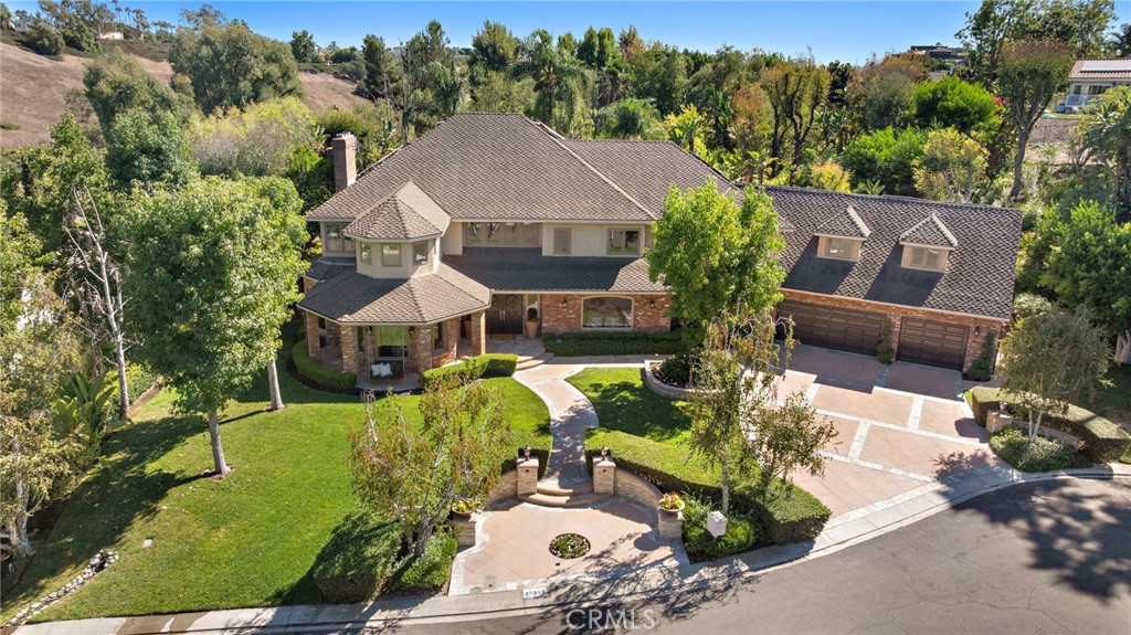 Nellie Gail is surrounded by tree lined hills and horse trails. - 25512 Saddle Rock Place, Laguna Hills CA 92653 - photo 1