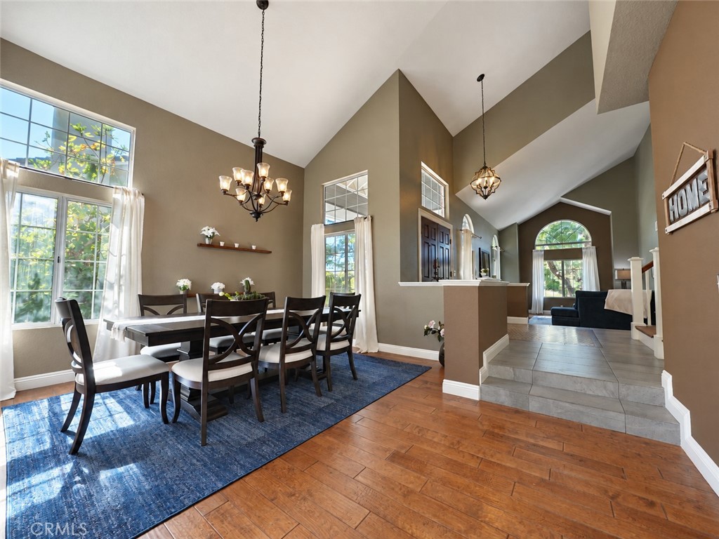 Enjoy this beautiful dining room for formal gatherings enhanced with vaulted ceilings - 25652 Nottingham Court, Laguna Hills CA 92653 - photo 5
