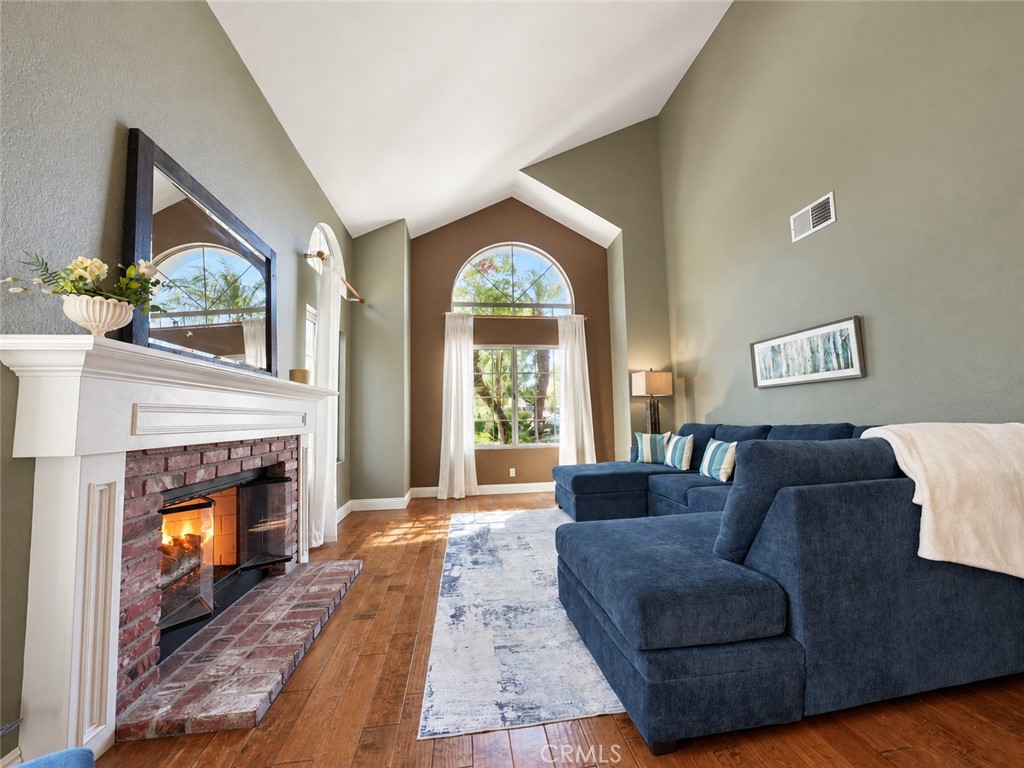Living room invites cozy evenings at home or entertaining friends and family by the fire - 25652 Nottingham Court, Laguna Hills CA 92653 - photo 6