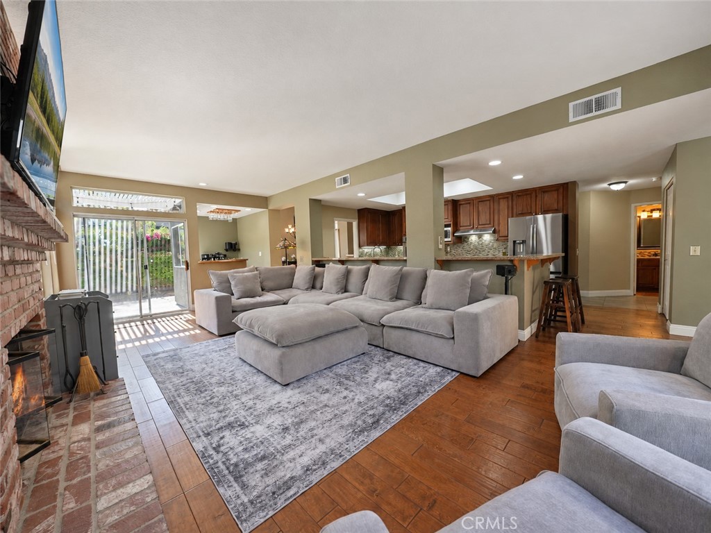 Enjoy this generous living space perfect for relaxing and entertaining - 25652 Nottingham Court, Laguna Hills CA 92653 - photo 11