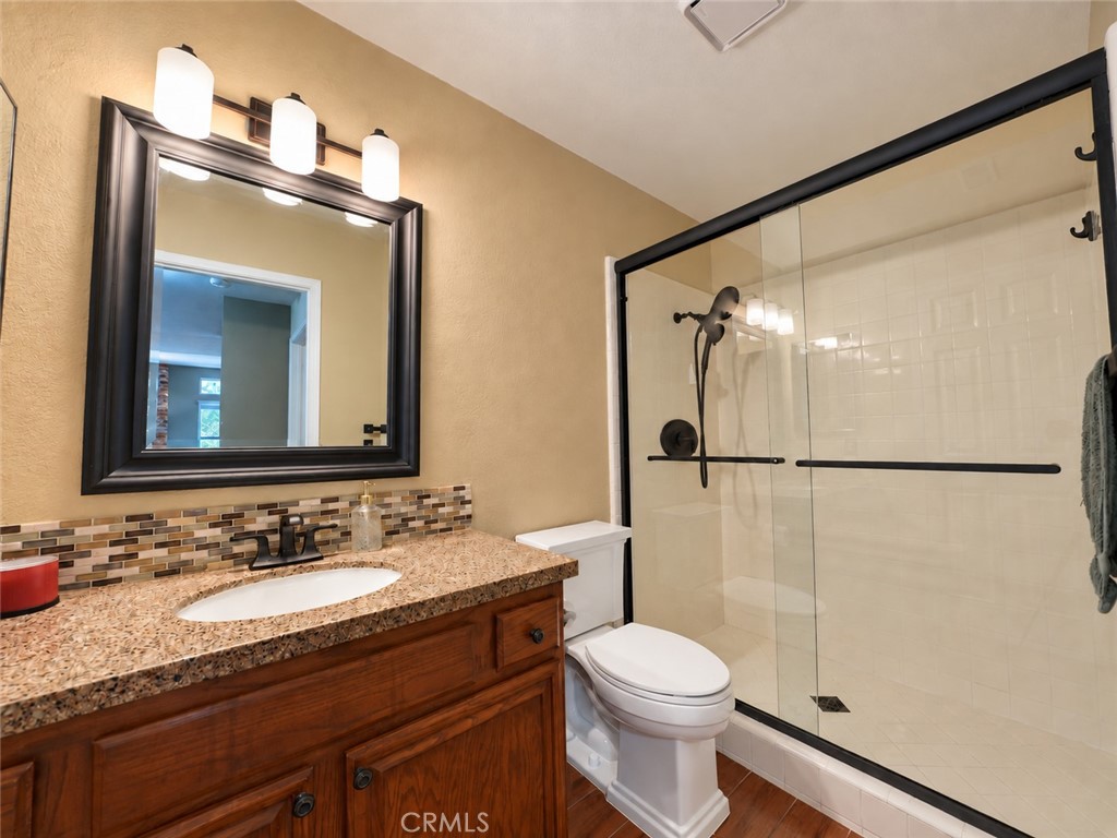Downstairs guest bathroom - 25652 Nottingham Court, Laguna Hills CA 92653 - photo 15
