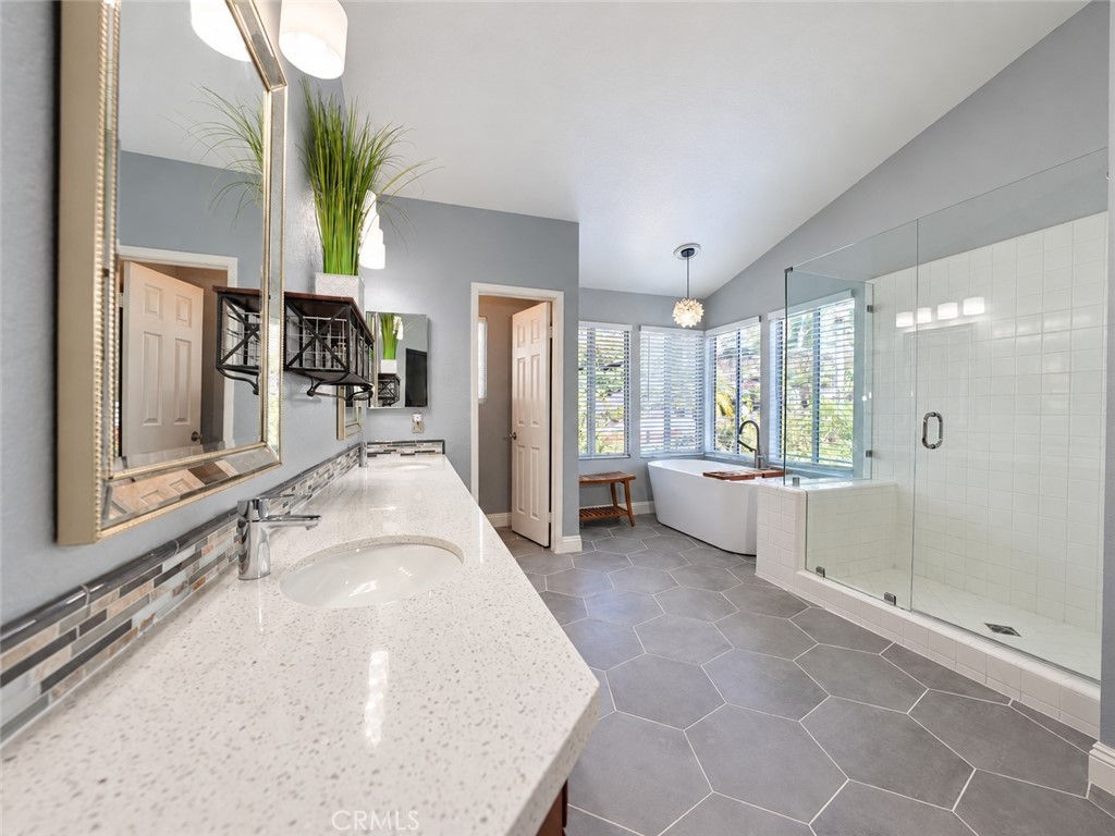 Enjoy this fabulous Master Bathroom Remodel with a frameless walk-in shower and soaking tub - 25652 Nottingham Court, Laguna Hills CA 92653 - photo 23