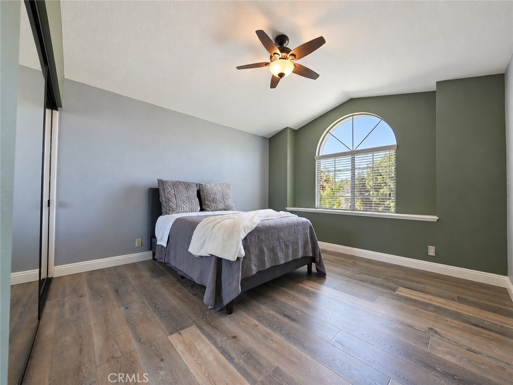 Bright and airy second bedroom with walk-in closet - 25652 Nottingham Court, Laguna Hills CA 92653 - photo 24