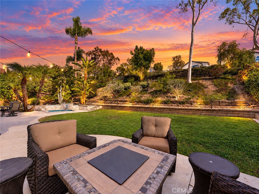 You'll enjoy a perfect setting for relaxing and entertaining while watching a sunset. Sunset digitally altered - 25652 Nottingham Court, Laguna Hills CA 92653 - photo 39