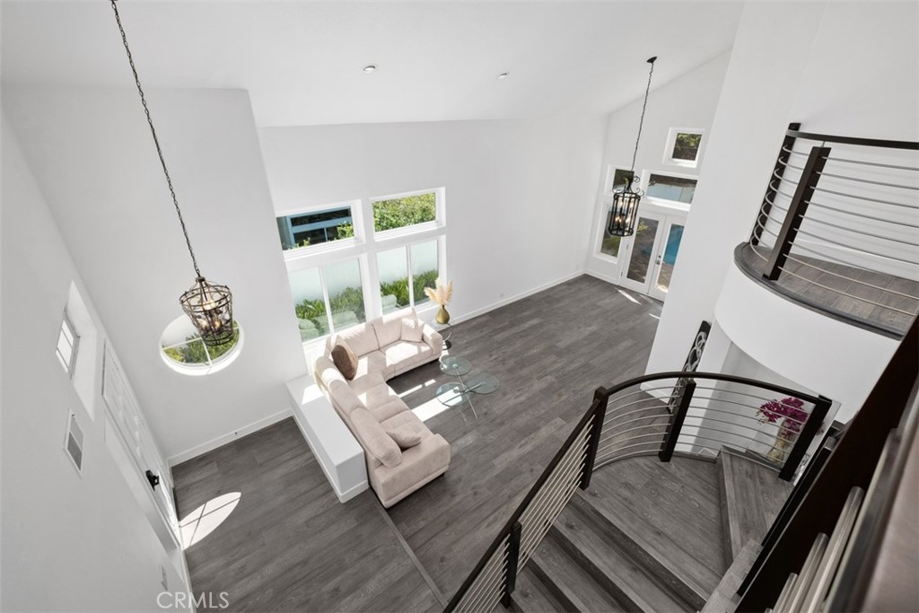 Livingroom Two story ceilings - from upstairs hallway - 26741 Bridlewood Drive, Laguna Hills CA 92653 - photo 21