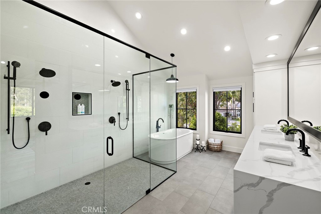 Dual shower heads, soaking tub and dual sinks in primary bathroomn suite - 27562 Lost Trail Drive, Laguna Hills CA 92653 - photo 29