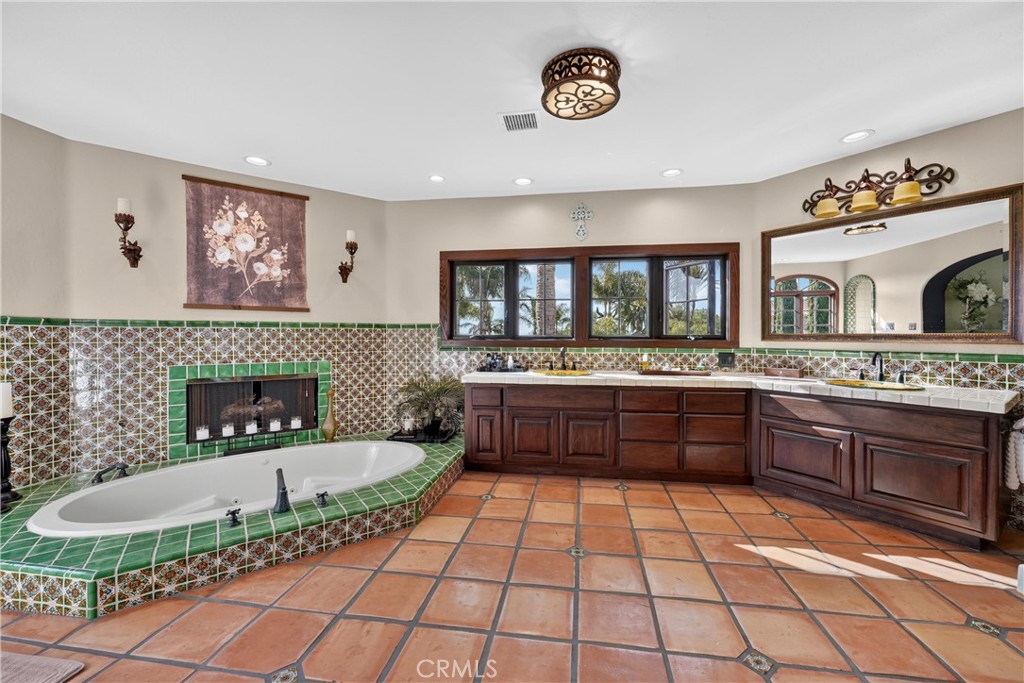 Primary bathroom with jetted tub and fireplace - 27641 Deputy, Laguna Hills CA 92653 - photo 43