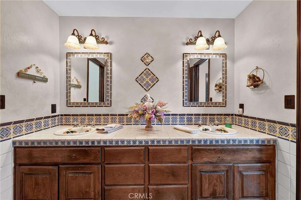 Shared upstairs bathroom with dual vanities - 27641 Deputy, Laguna Hills CA 92653 - photo 51
