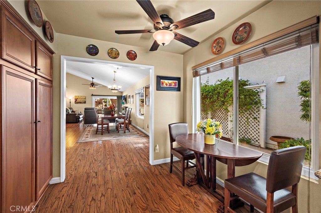 View from kitchen into great room with a view of the outdoors through the large window - 30 Oxbow Creek, Laguna Hills CA 92653 - photo 13