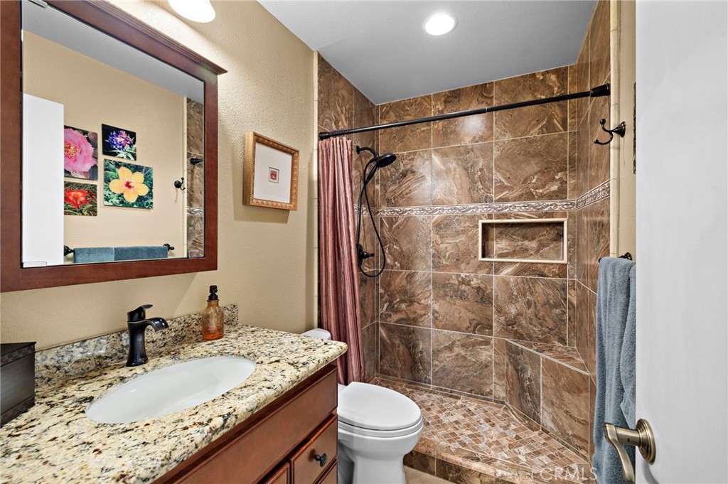 Updated guest bathroom with walk-in shower - 30 Oxbow Creek, Laguna Hills CA 92653 - photo 17