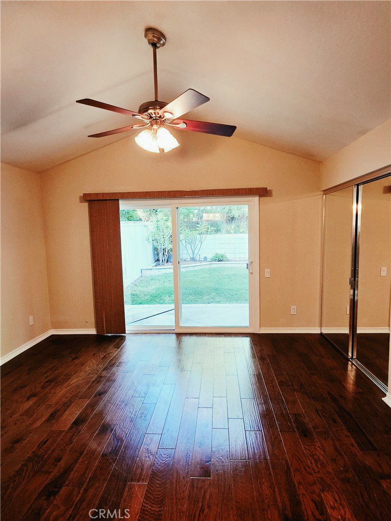 Primary bedroom with high ceilings, mirror wardrobe doors, direct access to relax in your backyard. - 41 Jasmine Creek, Laguna Hills CA 92653 - photo 7