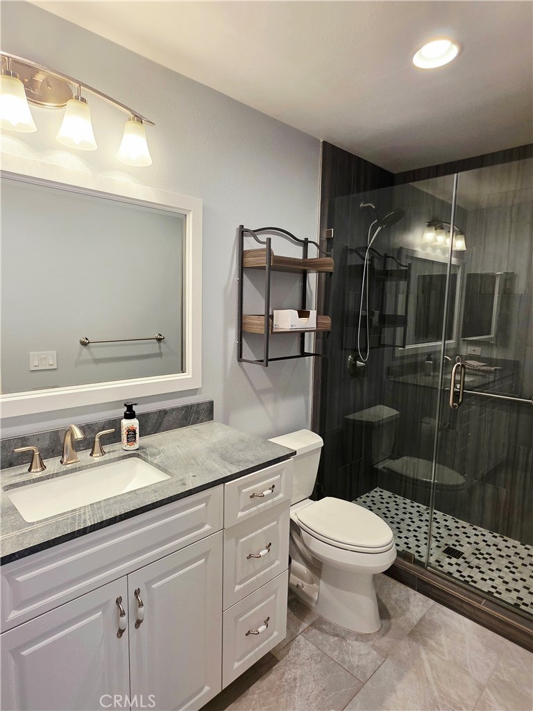 Newly renovated primary bathroom with walk in shower. - 41 Jasmine Creek, Laguna Hills CA 92653 - photo 8