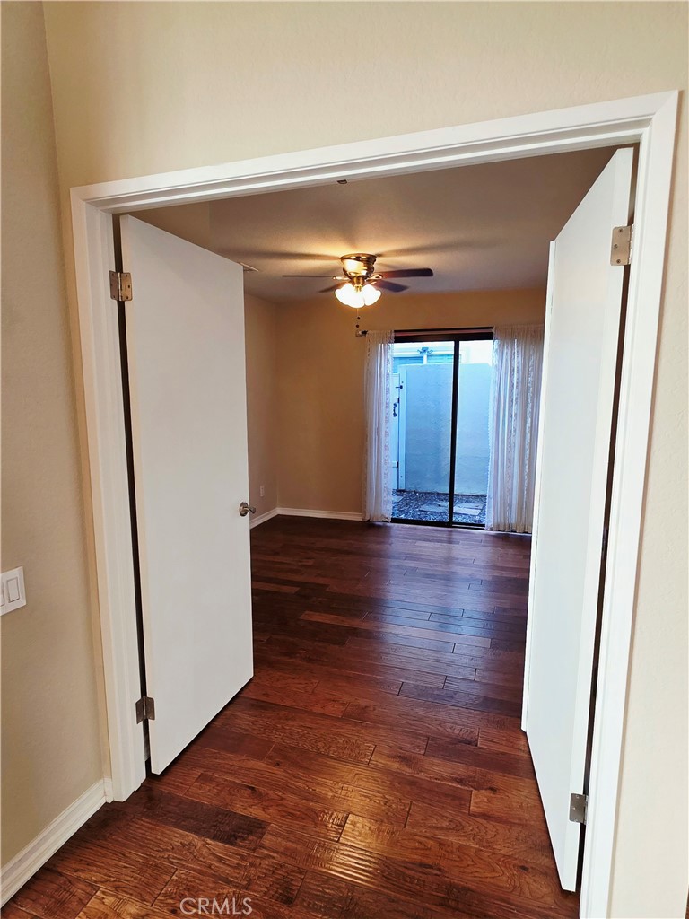 Secondary bedroom, dual entry for easy wheelchair access, mirror wardrobe doors, private patio. - 41 Jasmine Creek, Laguna Hills CA 92653 - photo 9