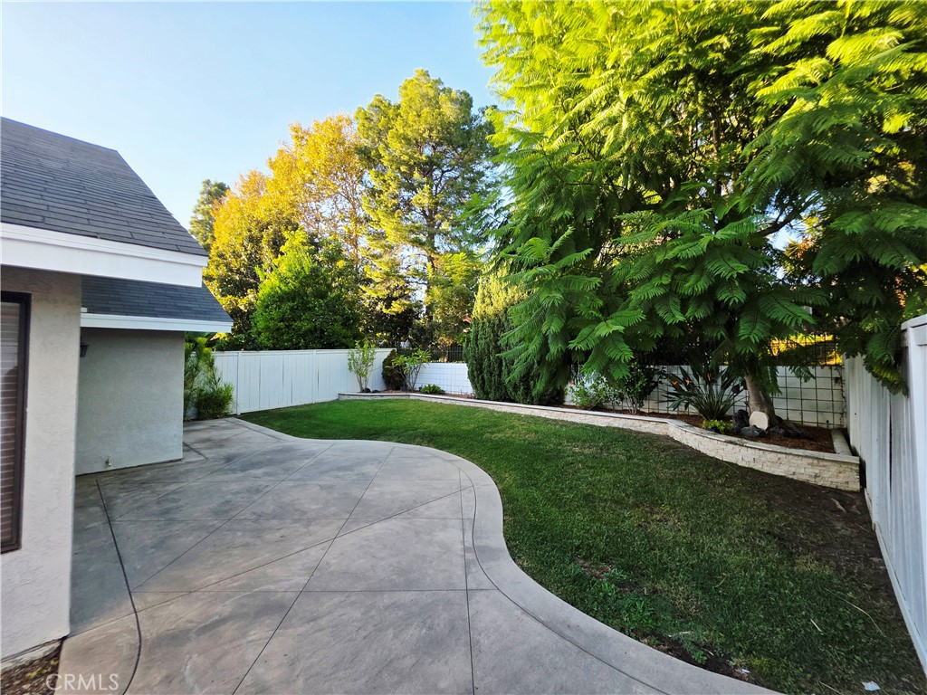 Private manicured backyard with mature trees and plantings. - 41 Jasmine Creek, Laguna Hills CA 92653 - photo 12