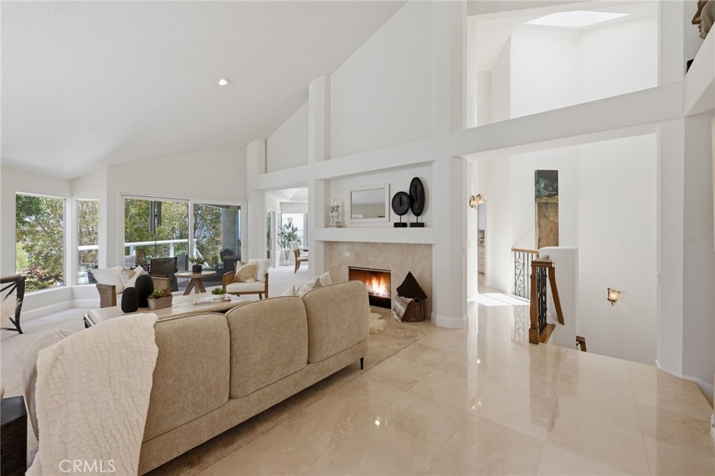 This image has been digitally enhanced to include a fire effect within the fireplace. - 10 Toulon, Laguna Niguel CA 92677 - photo 5