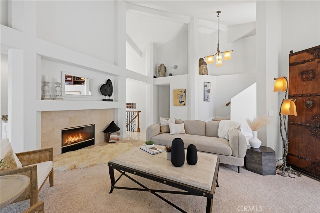 This image has been digitally enhanced to include a fire effect within the fireplace. - 10 Toulon, Laguna Niguel CA 92677 - photo 9