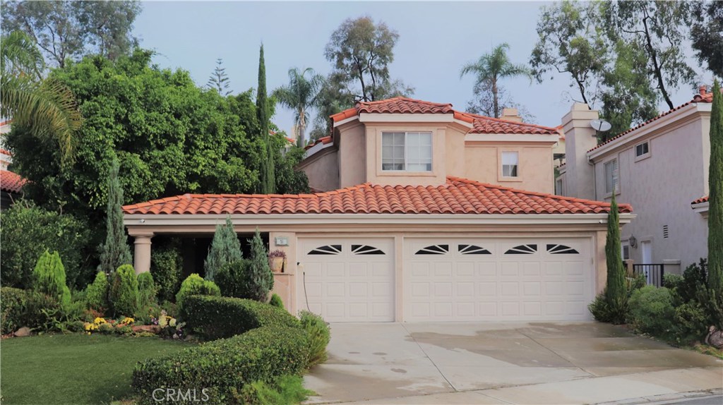 Exterior view with three car garage and private gated entrance. - 11 Coursan, Laguna Niguel CA 92677 - photo 1