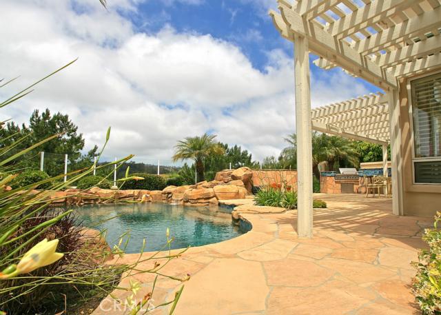 sandstone patio and rock hardscape to pebble finished pool and spa - 11 Siena, Laguna Niguel CA 92677 - photo 1