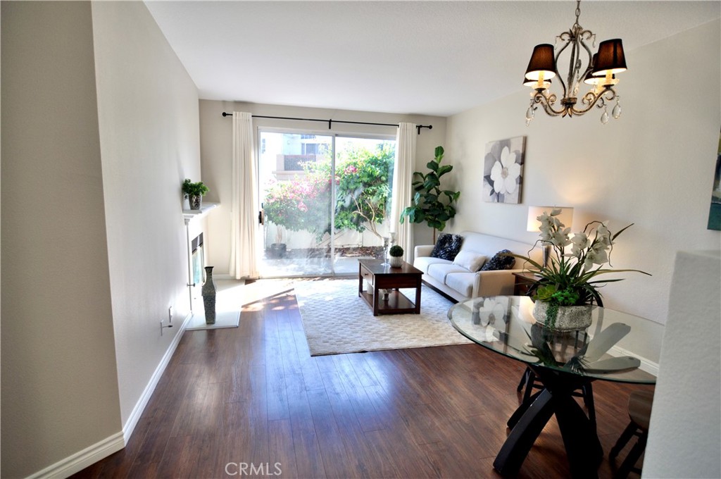 Welcome home! Spacious living room with view to the outside patio. - 110 Chandon, Laguna Niguel CA 92677 - photo 1
