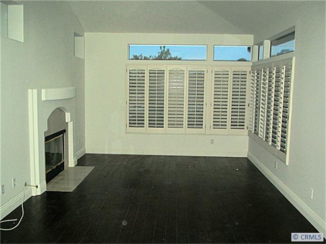 living room with fireplace - 112 STONEY, Laguna Niguel CA 92677 - photo 1