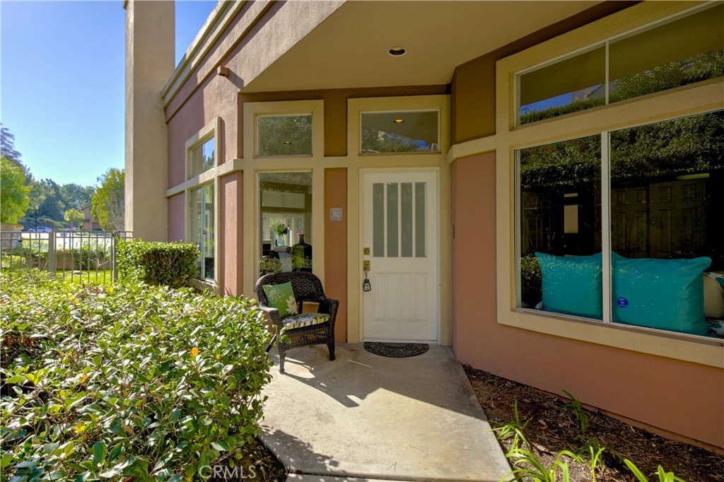 HOA maintained landscape frames the walk way to the front door. - 117 Costa Brava, Laguna Niguel CA 92677 - photo 1