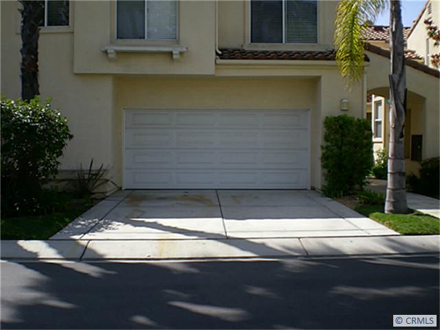 Two car garage with laundry hook ups. Driveway with room for cars. - 173 FLEURANCE Street, Laguna Niguel CA 92677 - photo 1