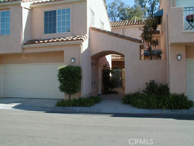 Townhouse across from guest parking and greenbelt to rear. - 209 Chandon, Laguna Niguel CA 92677 - photo 1