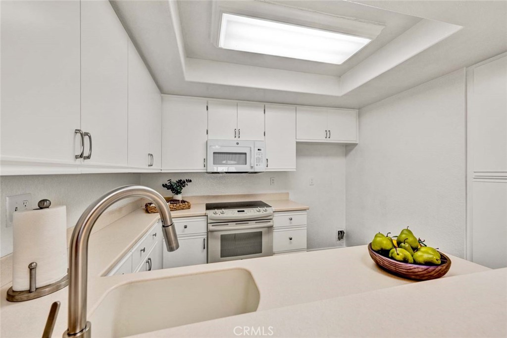 Modern, updated kitchen faucet featuring a sleek design and high-quality finish. - 22 Aruba, Laguna Niguel CA 92677 - photo 9