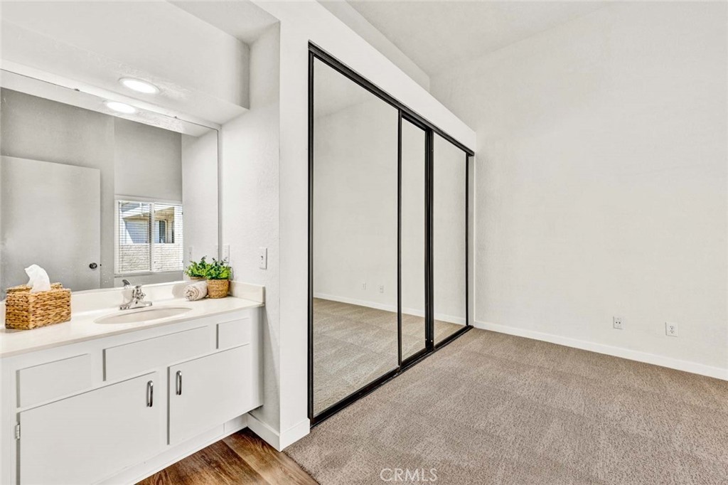 Primary bedroom with new carpet and mirrored closet doors - 22 Aruba, Laguna Niguel CA 92677 - photo 14