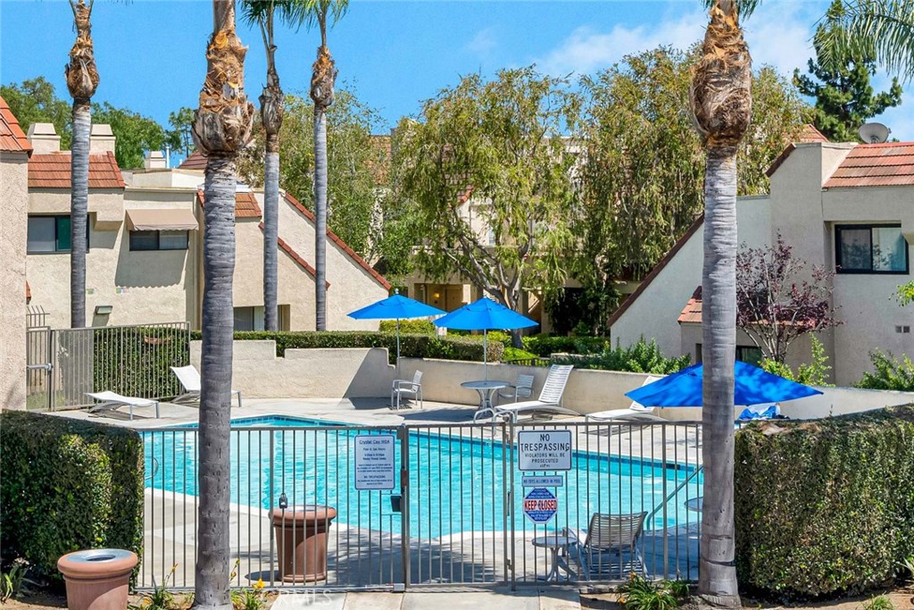 Community pool with lounge area - 22 Aruba, Laguna Niguel CA 92677 - photo 22