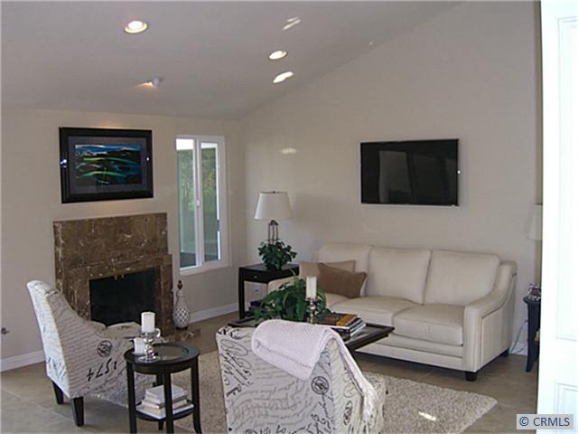 Light and bright living room with gas fireplace and views. - 22842 LATIGO Drive, Laguna Niguel CA 92677 - photo 1