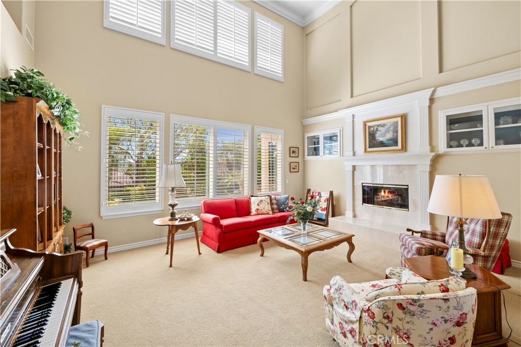 Stunning Formal Living Room with 2 way Gas Fireplace for your Enjoyment. - 23611 Trinidad Lane, Laguna Niguel CA 92677 - photo 5