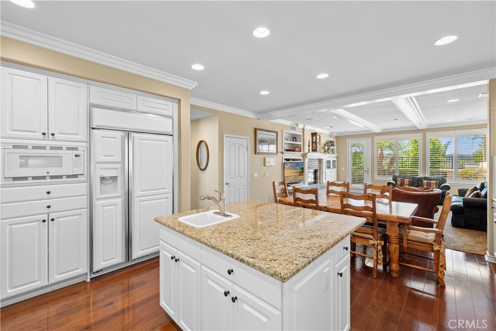 Immaculate Gourmet Kitchen with Center Island opens to a very Spacious Family Room. - 23611 Trinidad Lane, Laguna Niguel CA 92677 - photo 9