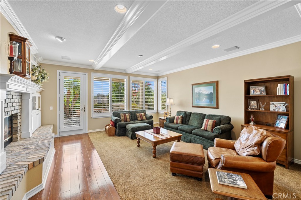 Gorgeous Beamed Ceilings in the Family Room with a 2 way Fireplace (that Shares with Living Room). - 23611 Trinidad Lane, Laguna Niguel CA 92677 - photo 11