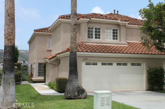 Your new home has grass and trees with a full driveway - it has the feeling of living in a house - 23921 Catamaran Way 64, Laguna Niguel CA 92677 - photo 1