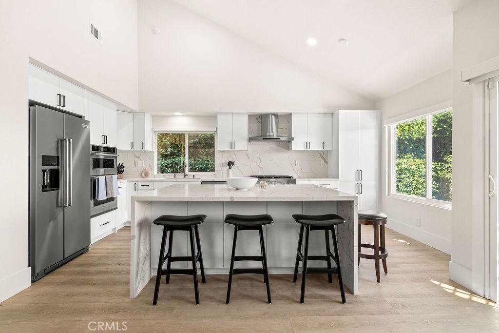 Kitchen island with seating - 23962 Caravel, Laguna Niguel CA 92677 - photo 13