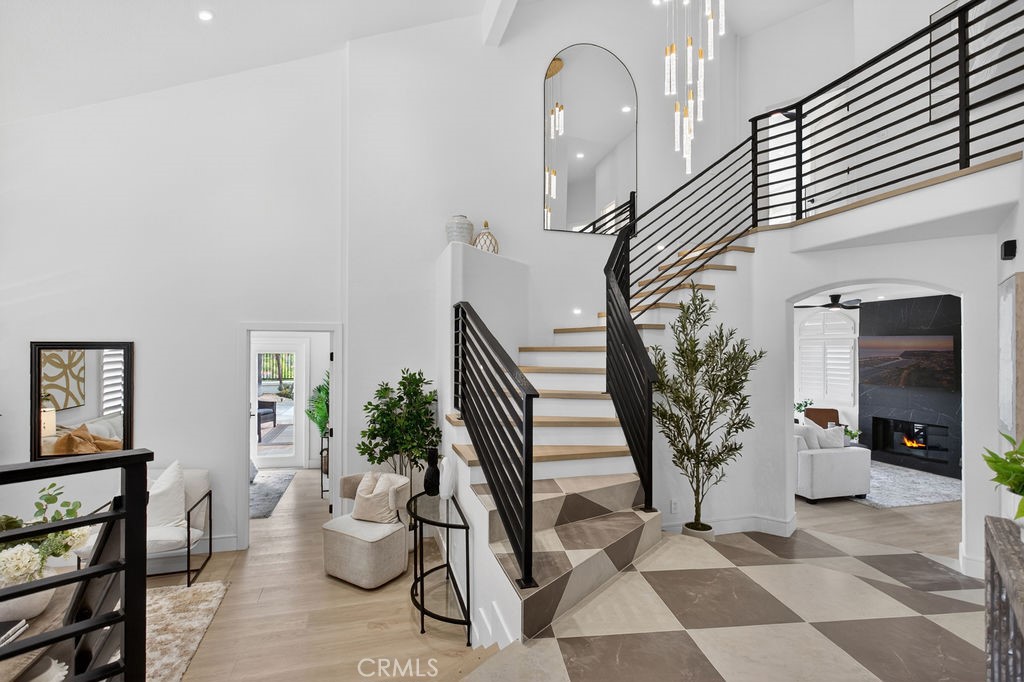 Breathtaking entry and welcome home: Custom Iron Staircase and chandelier - 24 Corsica, Laguna Niguel CA 92677 - photo 5