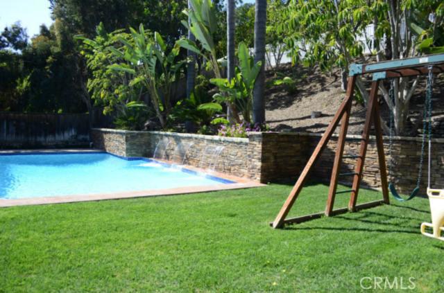 Grassy play area & pool with removable child safety fence - 24171 Paseo Del Campo, Laguna Niguel CA 92677 - photo 1